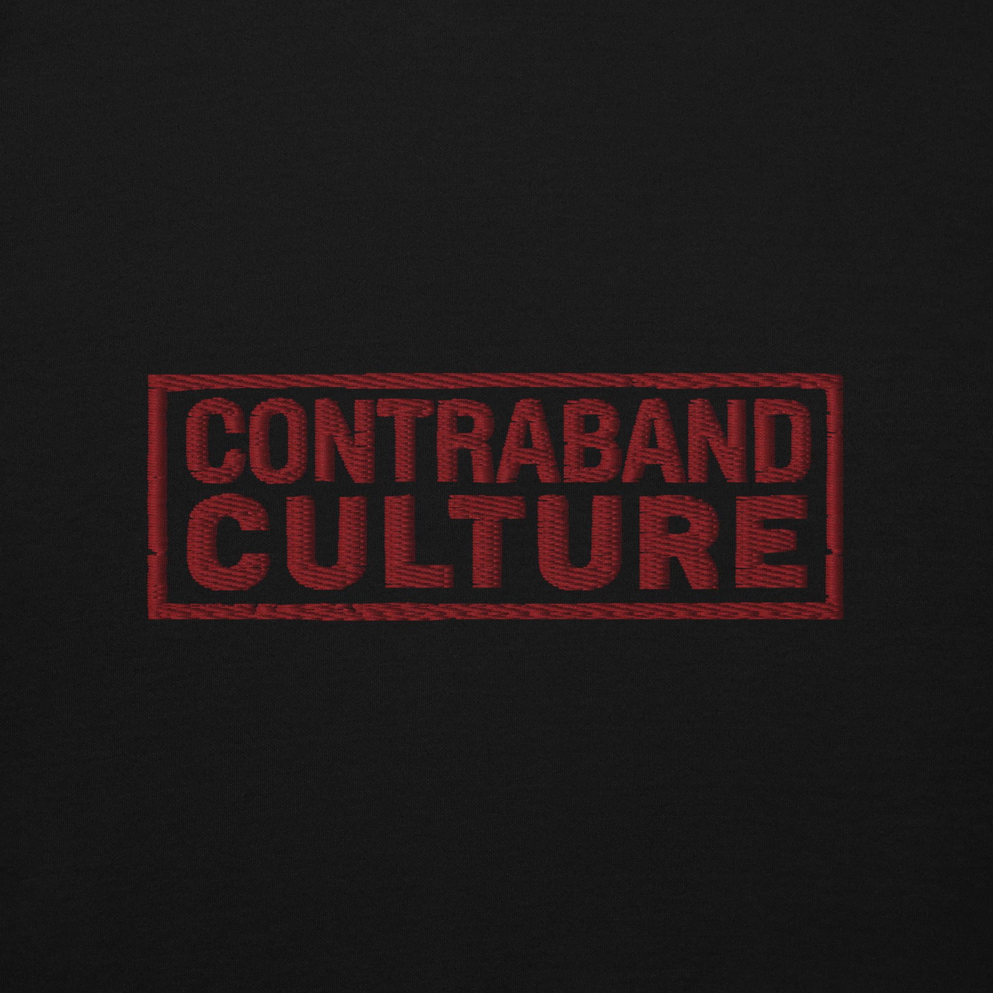 Red Contraband Culture logo embroidered on black fabric